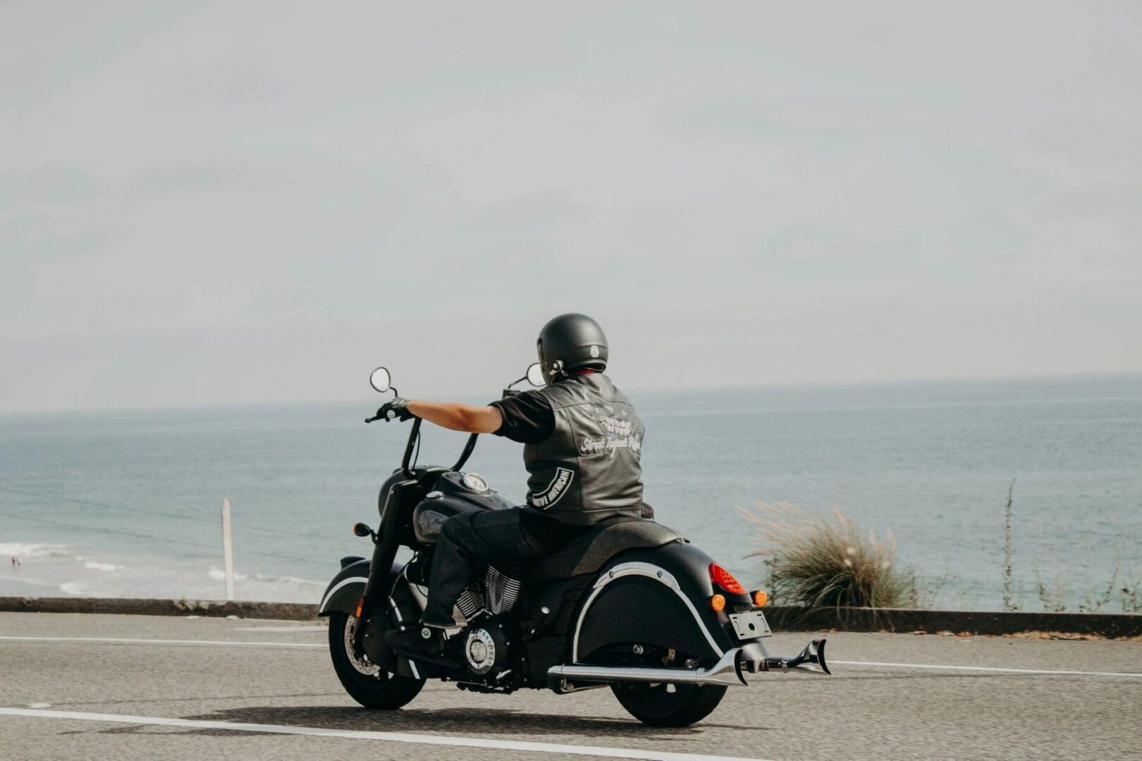 A person riding on the back of a motorcycle.